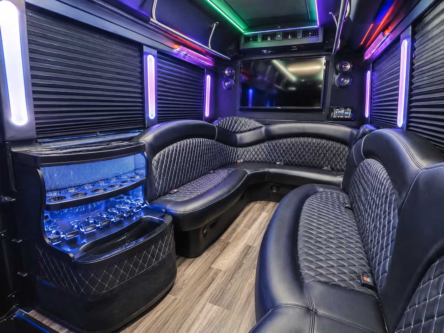 Wedding guests seated inside a party bus serving Tyler